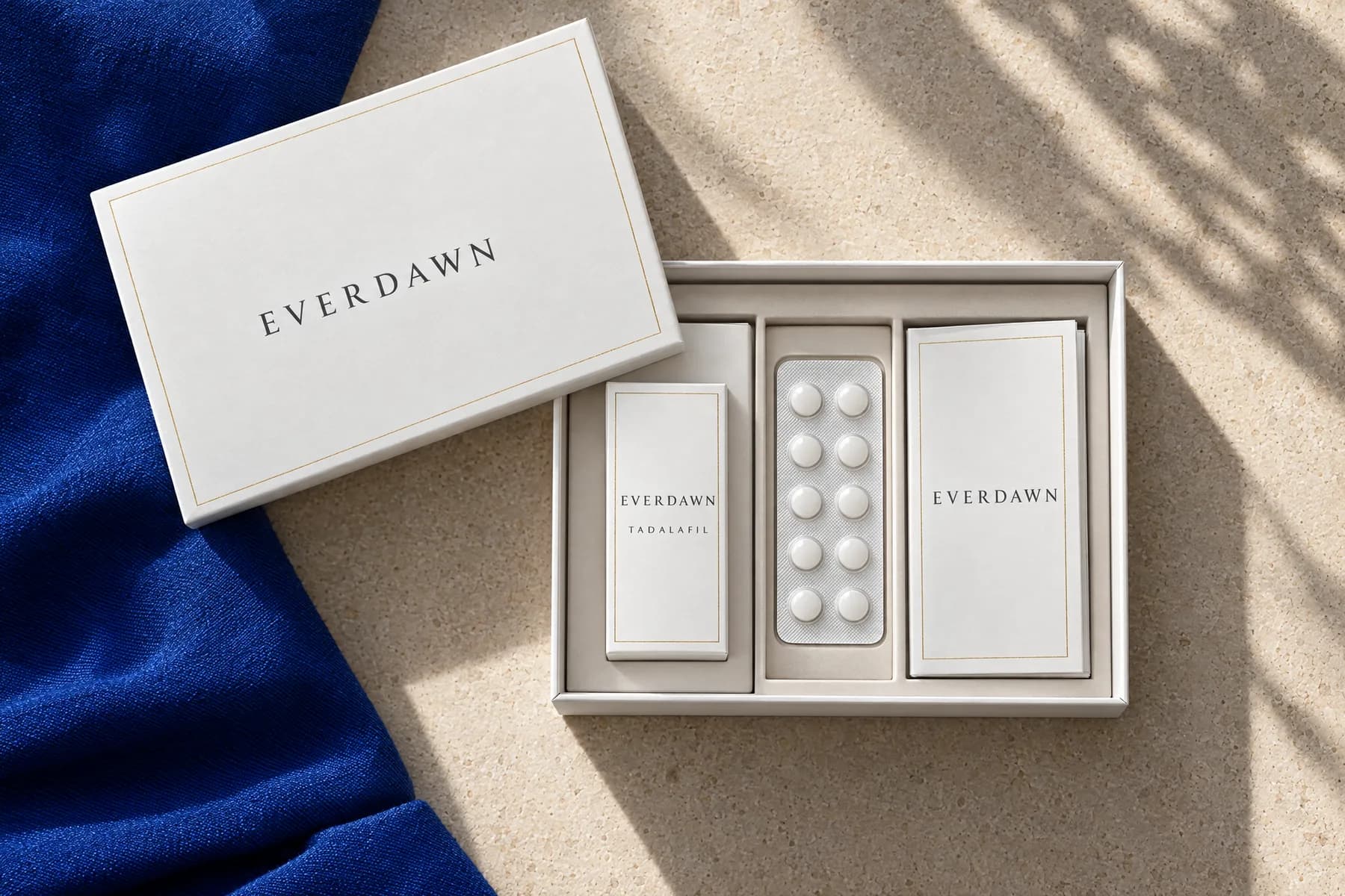 An opened, plain Everdawn box with a tablet carton, a blister card and a care card