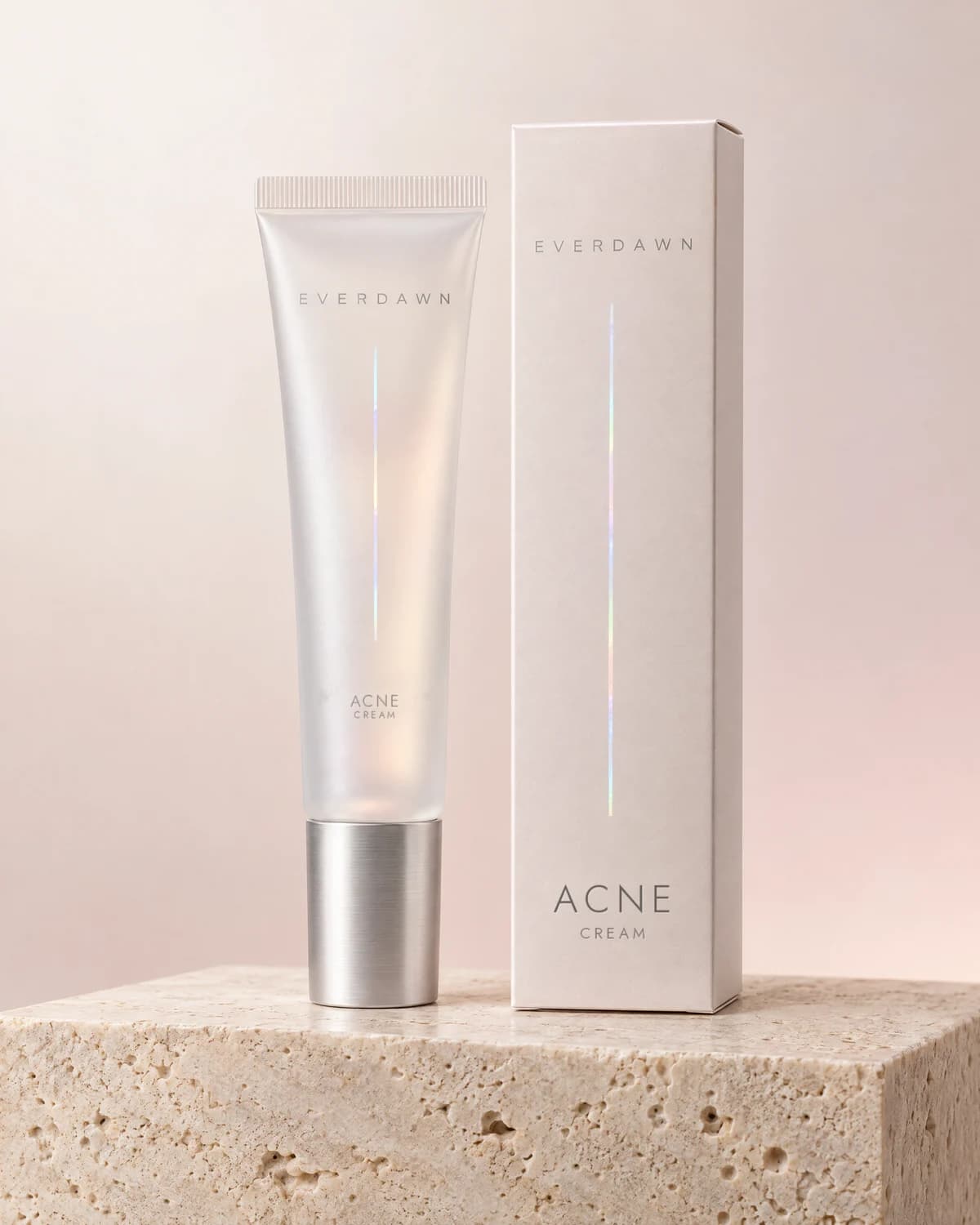 Illustrative packaging: an acne cream tube beside its carton on a travertine plinth against a soft studio background. Your medicine is labeled and dispensed by the licensed pharmacy.