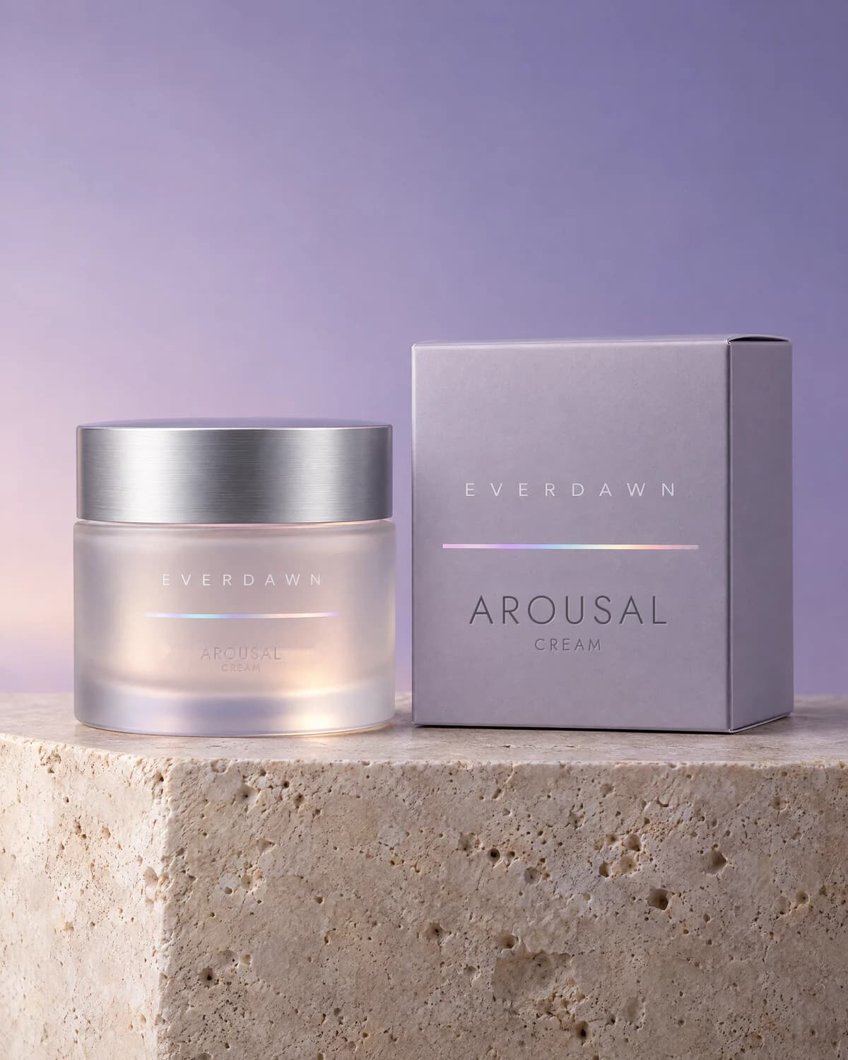 Illustrative packaging: an arousal cream jar beside its carton on a travertine plinth against a soft studio background. Your medicine is labeled and dispensed by the licensed pharmacy.