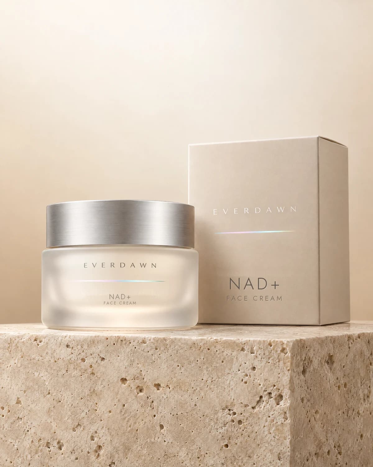 Illustrative packaging: an NAD+ face cream frosted jar beside its carton on a travertine plinth against a soft studio background. Your medicine is labeled and dispensed by the licensed pharmacy.