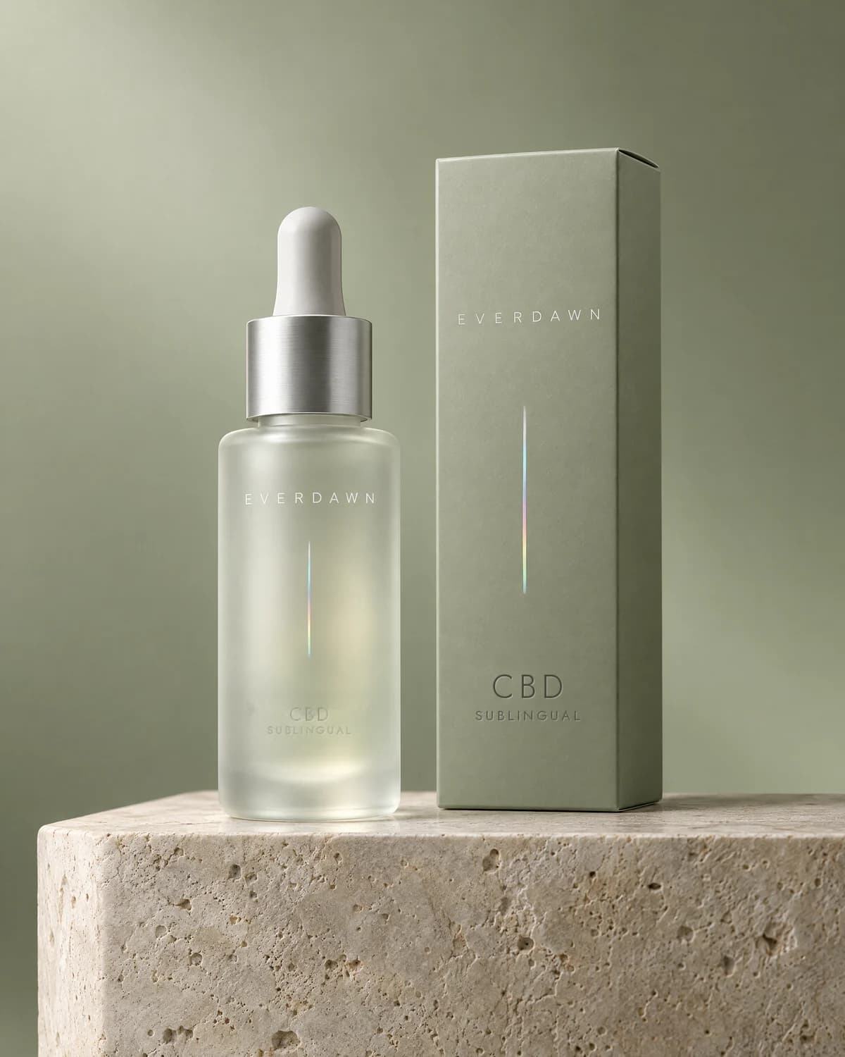 Illustrative packaging: a CBD sublingual dropper bottle beside its carton on a travertine plinth against a soft studio background. Your medicine is labeled and dispensed by the licensed pharmacy.